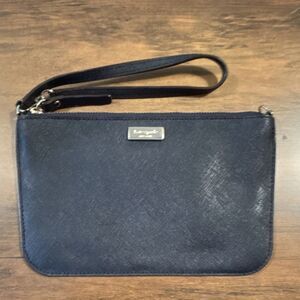 Kate Spade New York Navy Wristlet with Gold Logo and Wrist Strap